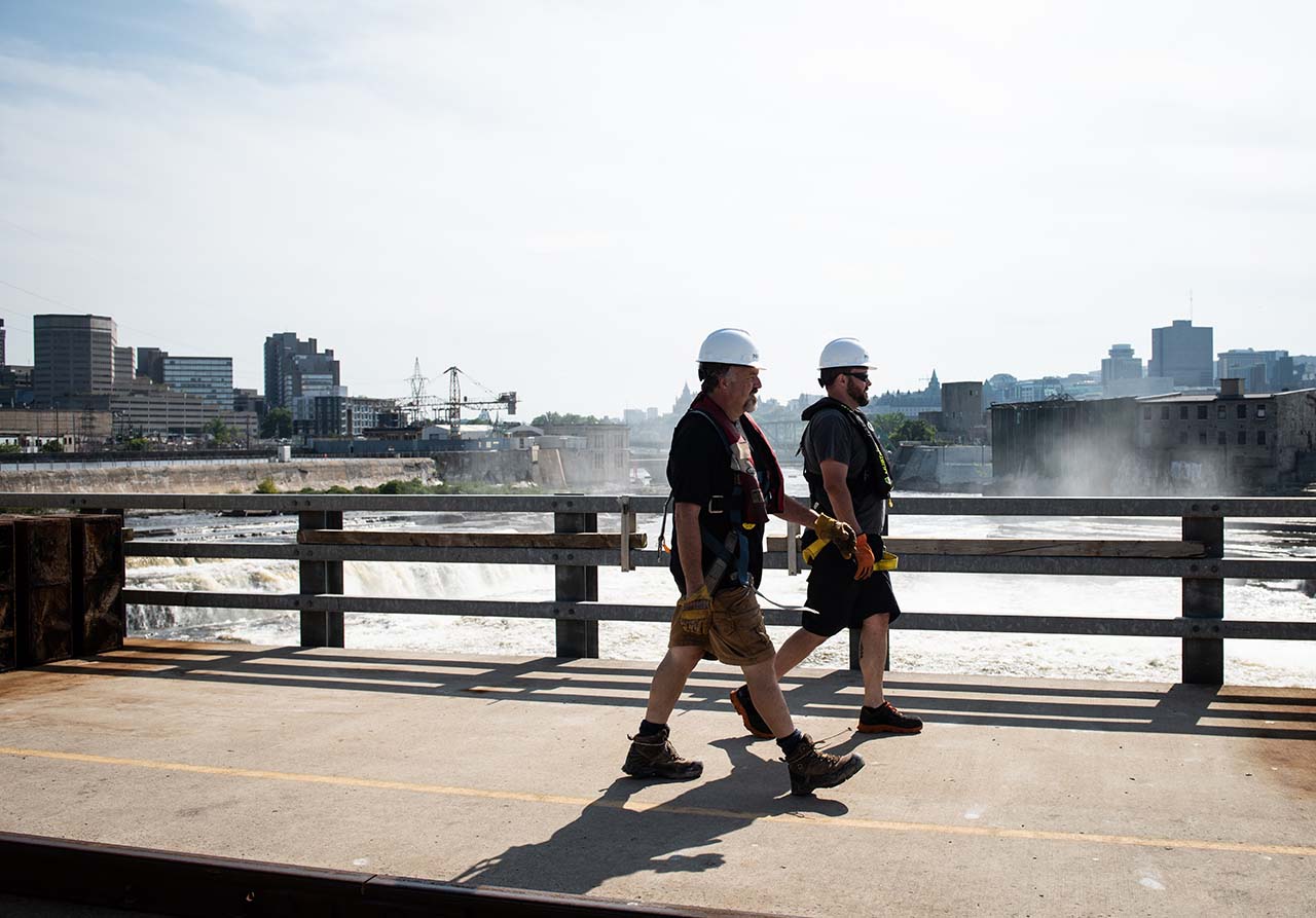 Two Portage Power employees walking